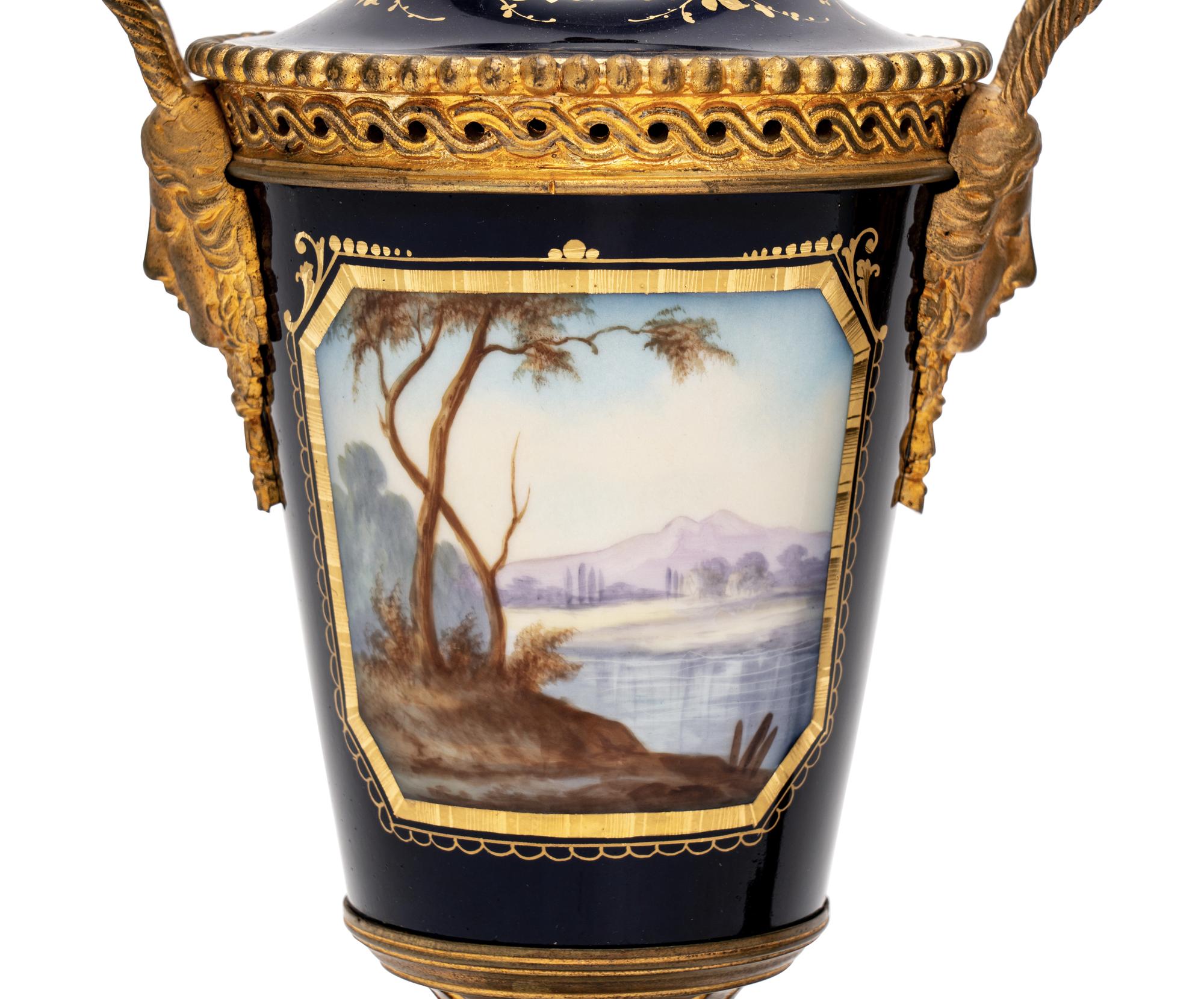 A Pair of Sèvres Style Gilt Bronze-Mounted Porcelain Urns