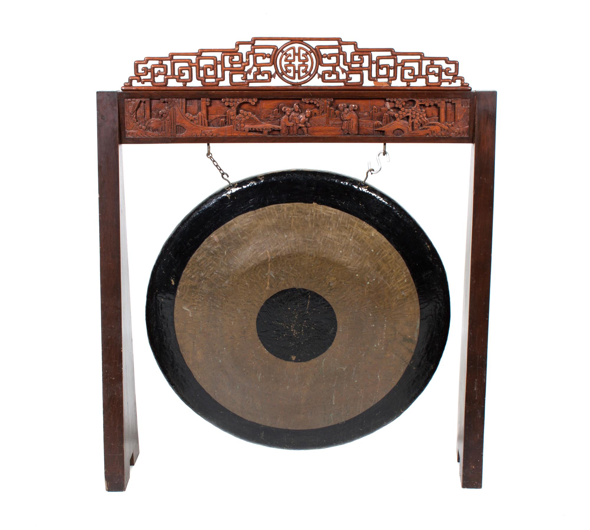 A Chinese Carved Wood Frame and Gong Height 52 1/2 inches.