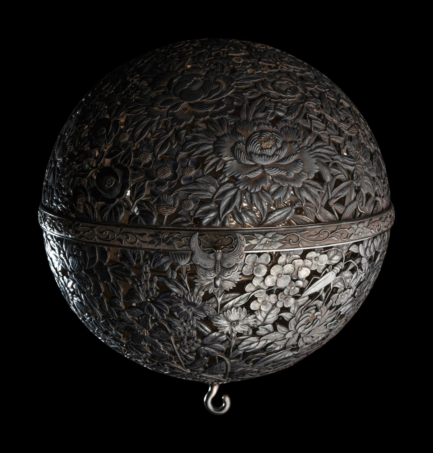 A Japanese Silver and Parcel Gilt Hanging Incense Ball