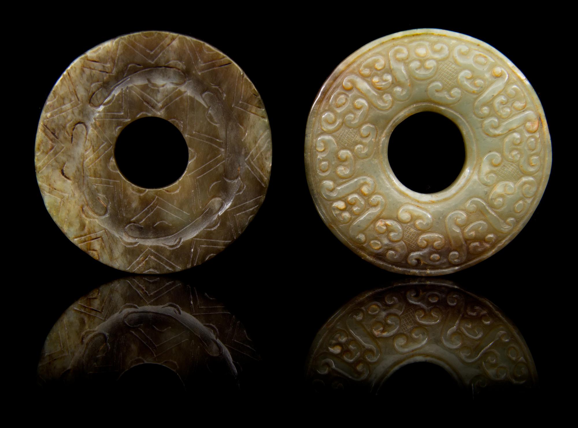 Two Jade Bis Diameter of first 2 3/8 inches.
