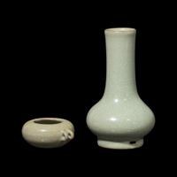 A Chinese Longquan Guan Type Celadon Vase and a Bird Feeder 龍泉青釉穿帶瓶及鳥食罐