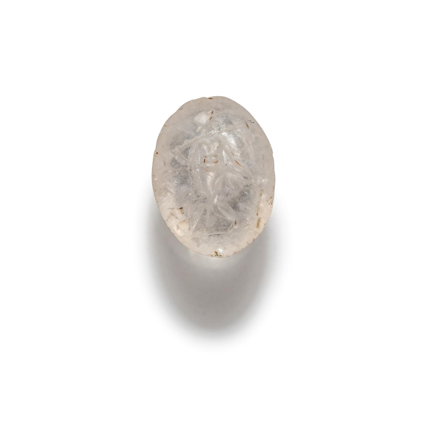 A Roman Rock Crystal Ring stone with the Gods Silenus and Infant Dionysus