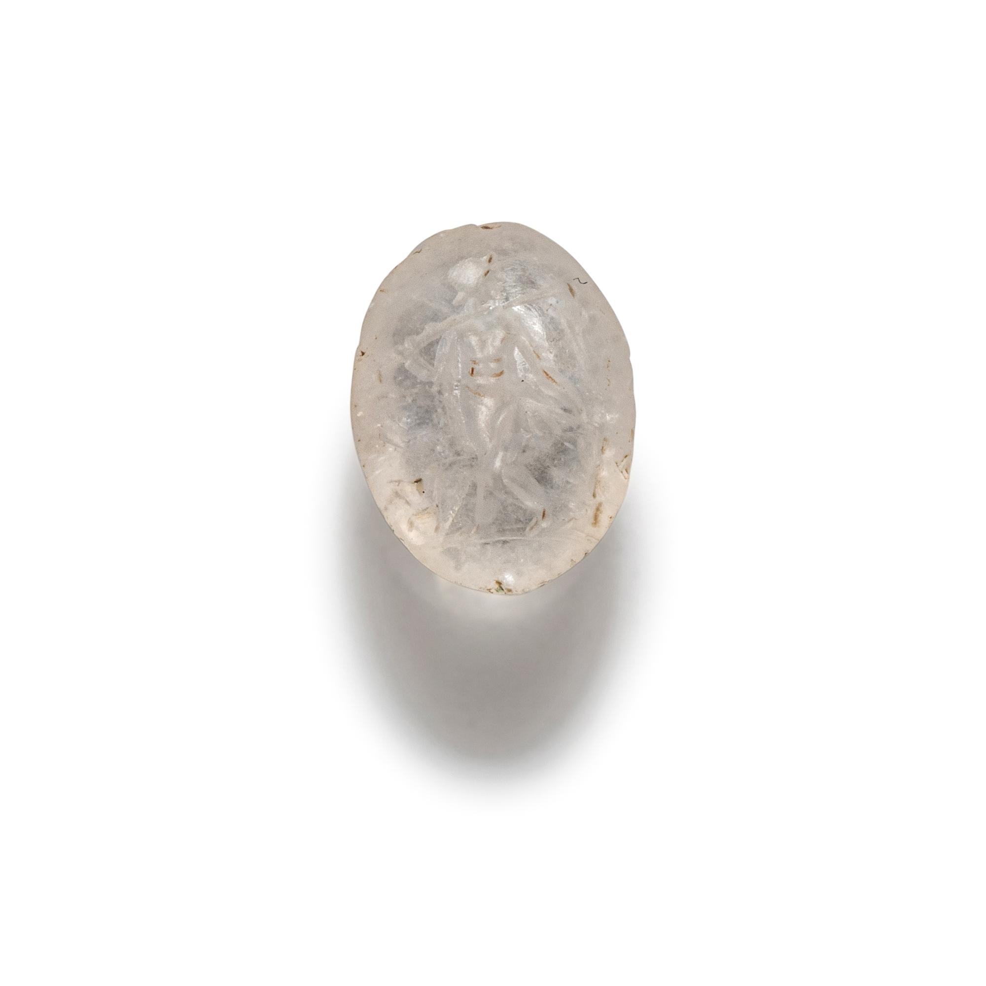 A Roman Rock Crystal Ring stone with the Gods Silenus and Infant Dionysus