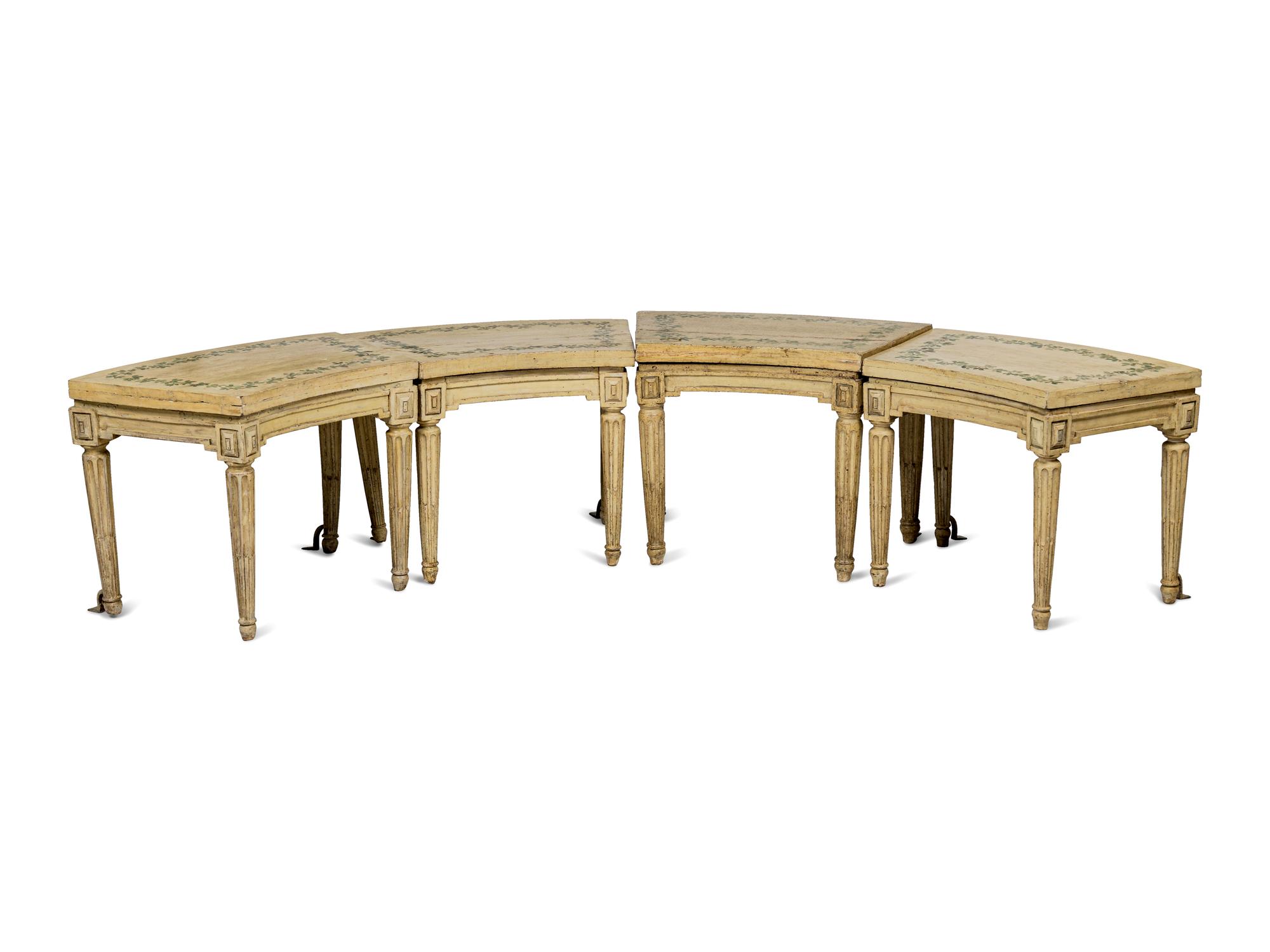 A Set of Four Louis XVI Cream and Polychrome Decorated Curved Window Benches