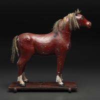 A Carved and Painted Wood Horse Pull Toy