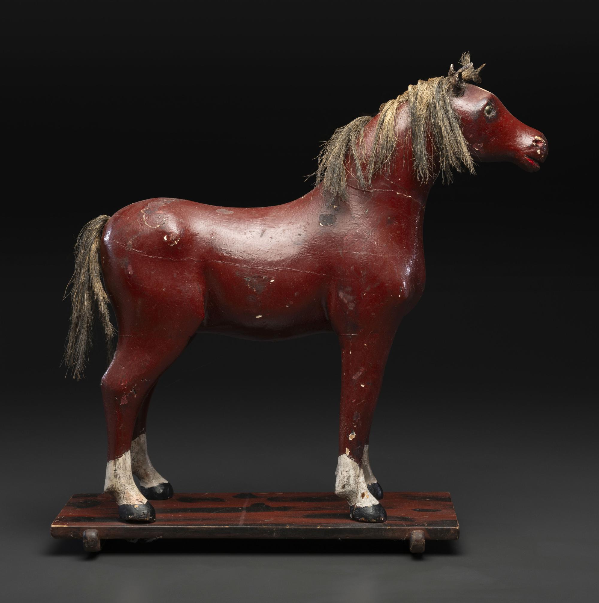 A Carved and Painted Wood Horse Pull Toy