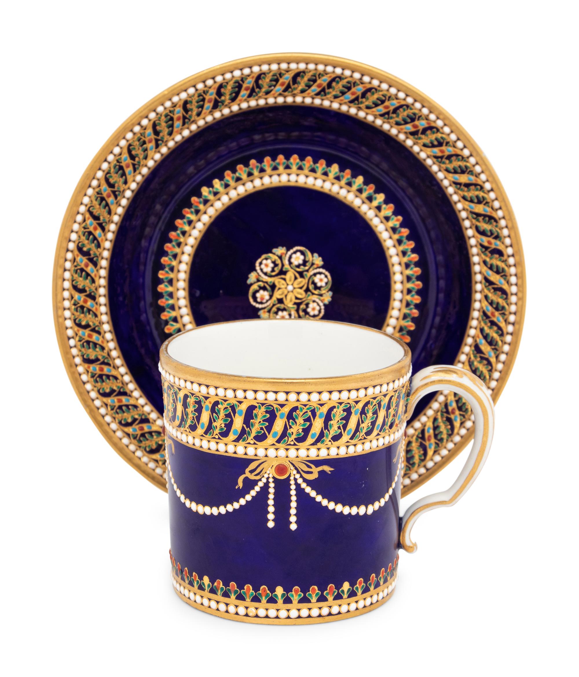 A Sèvres Partially Beau Bleu Jewelled Porcelain Coffee Can and Saucer ( Gobelet 'Litron' et sa Soucoupe, 1ère Grandeur )
