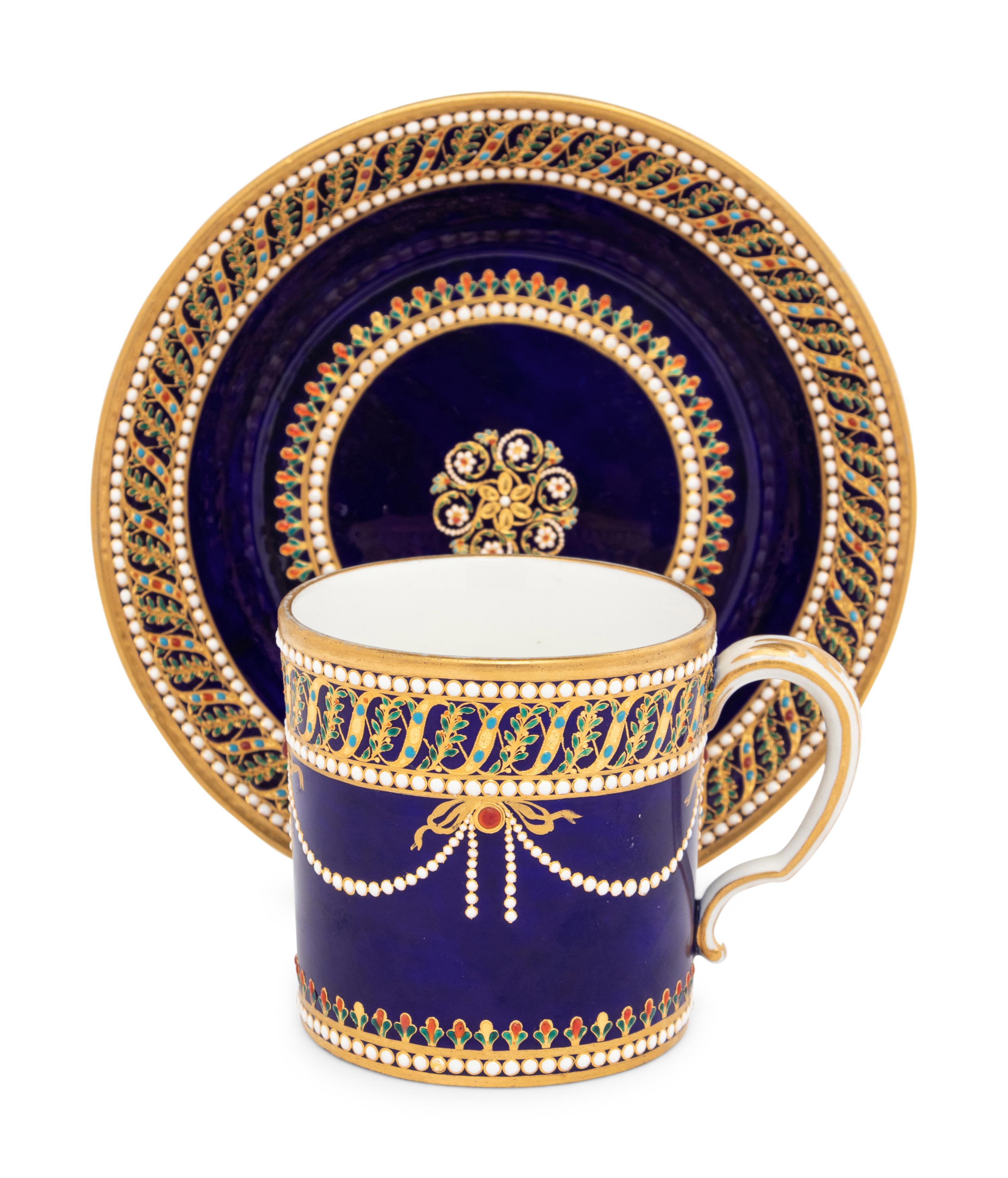 A Sèvres Partially Beau Bleu Jewelled Porcelain Coffee Can and Saucer ( Gobelet 'Litron' et sa Soucoupe, 1ère Grandeur )