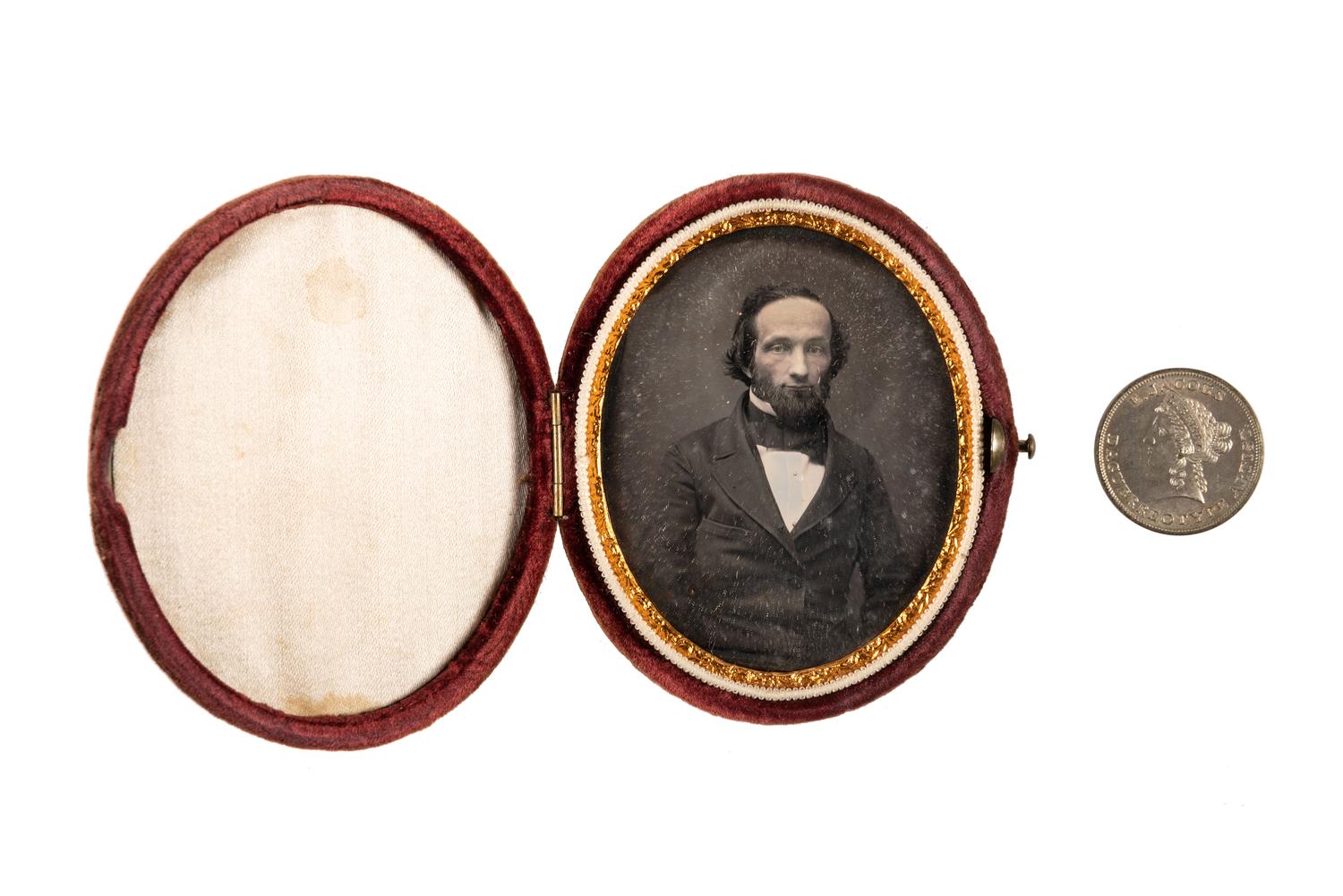 [EARLY PHOTOGRAPHY]. A group of daguerreotype portraits, incl. pendant, possible Hawaiian subject, and case featuring portrait of Daguerre.