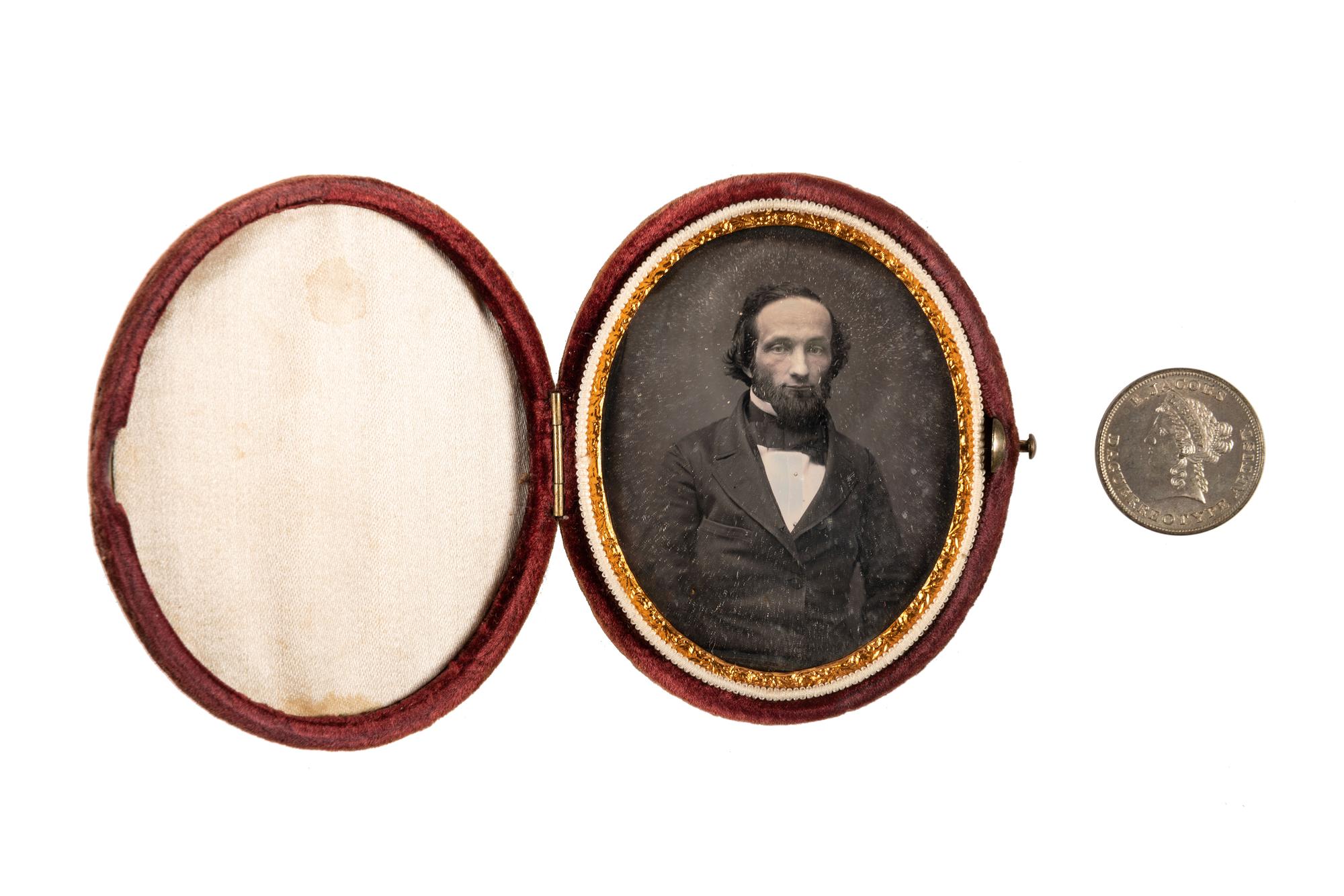 [EARLY PHOTOGRAPHY]. A group of daguerreotype portraits, incl. pendant, possible Hawaiian subject, and case featuring portrait of Daguerre.