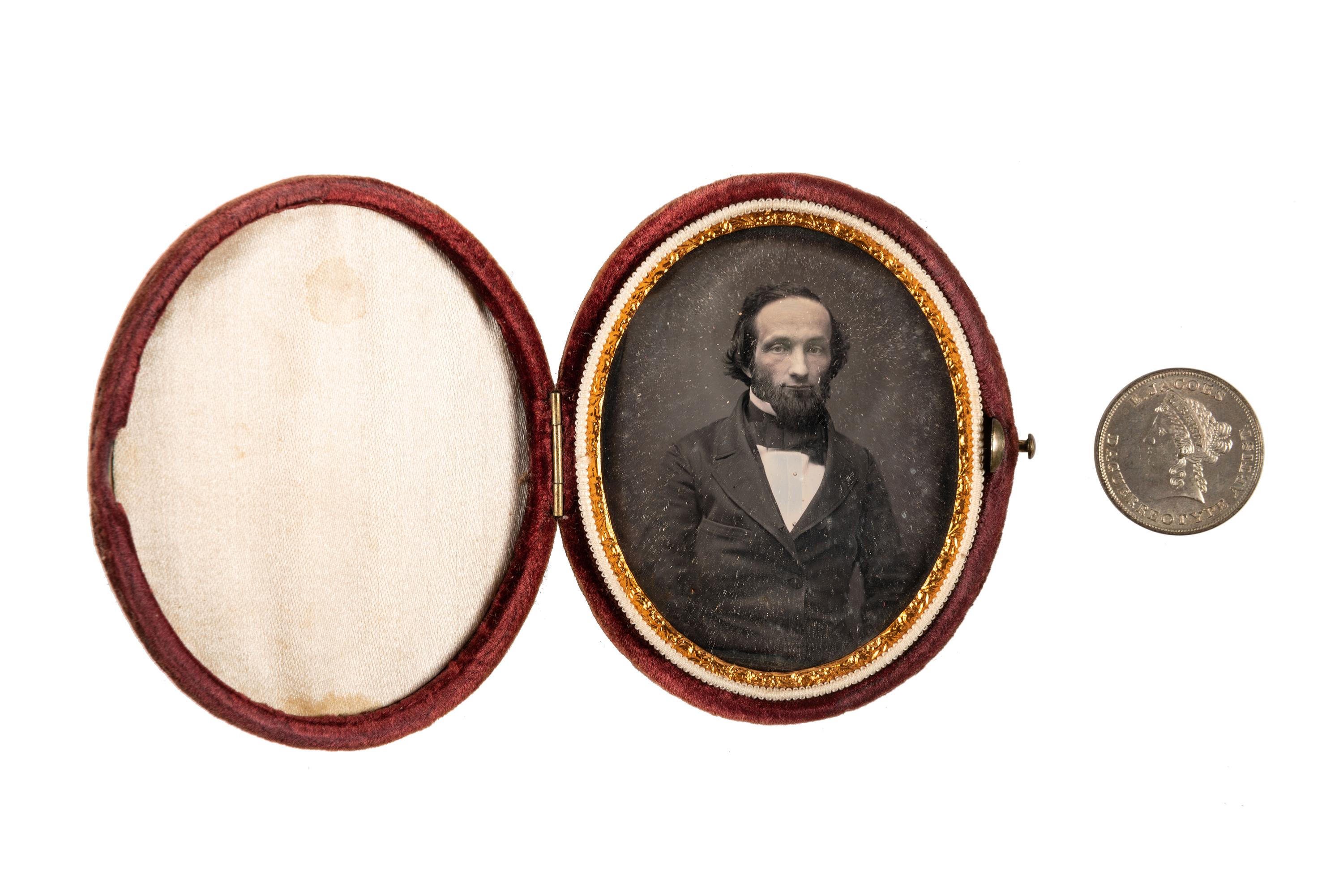 [EARLY PHOTOGRAPHY]. A group of daguerreotype portraits, incl. pendant, possible Hawaiian subject, and case featuring portrait of Daguerre.