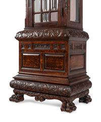 A Renaissance Revival Carved Oak Eight-Tube Tall Case Clock
