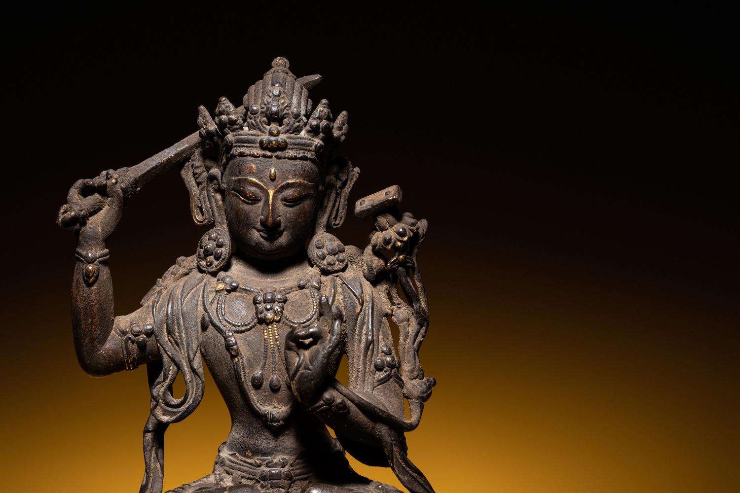 A Sino-Tibetan Parcel-Gilt Bronze Figure of Manjushri