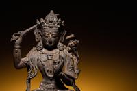 A Sino-Tibetan Parcel-Gilt Bronze Figure of Manjushri