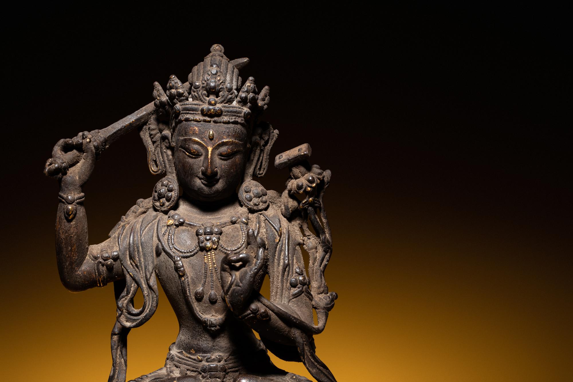 A Sino-Tibetan Parcel-Gilt Bronze Figure of Manjushri
