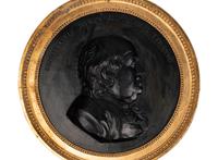 A Pair of Continental Cast Plaster Portrait Plaques of Benjamin Franklin and Thomas Jefferson