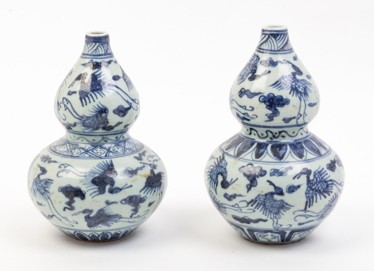 A Pair of Blue and White Porcelain Vases Height 9 inches.