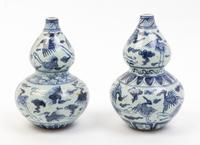 A Pair of Blue and White Porcelain Vases Height 9 inches.