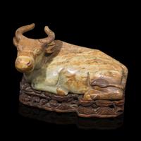 A Large Chinese Celadon and Beige Jade Buffalo, 18th/19th Century 清中期 青玉臥牛
