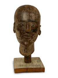 Two Plaster Studies of a Foot and a Profile Head together with a Continental Carved Wood Bust — 20TH CENTURY