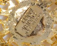 A Gianni Versace Triple Strand Medallion Link Bracelet, 7" X 3.75".