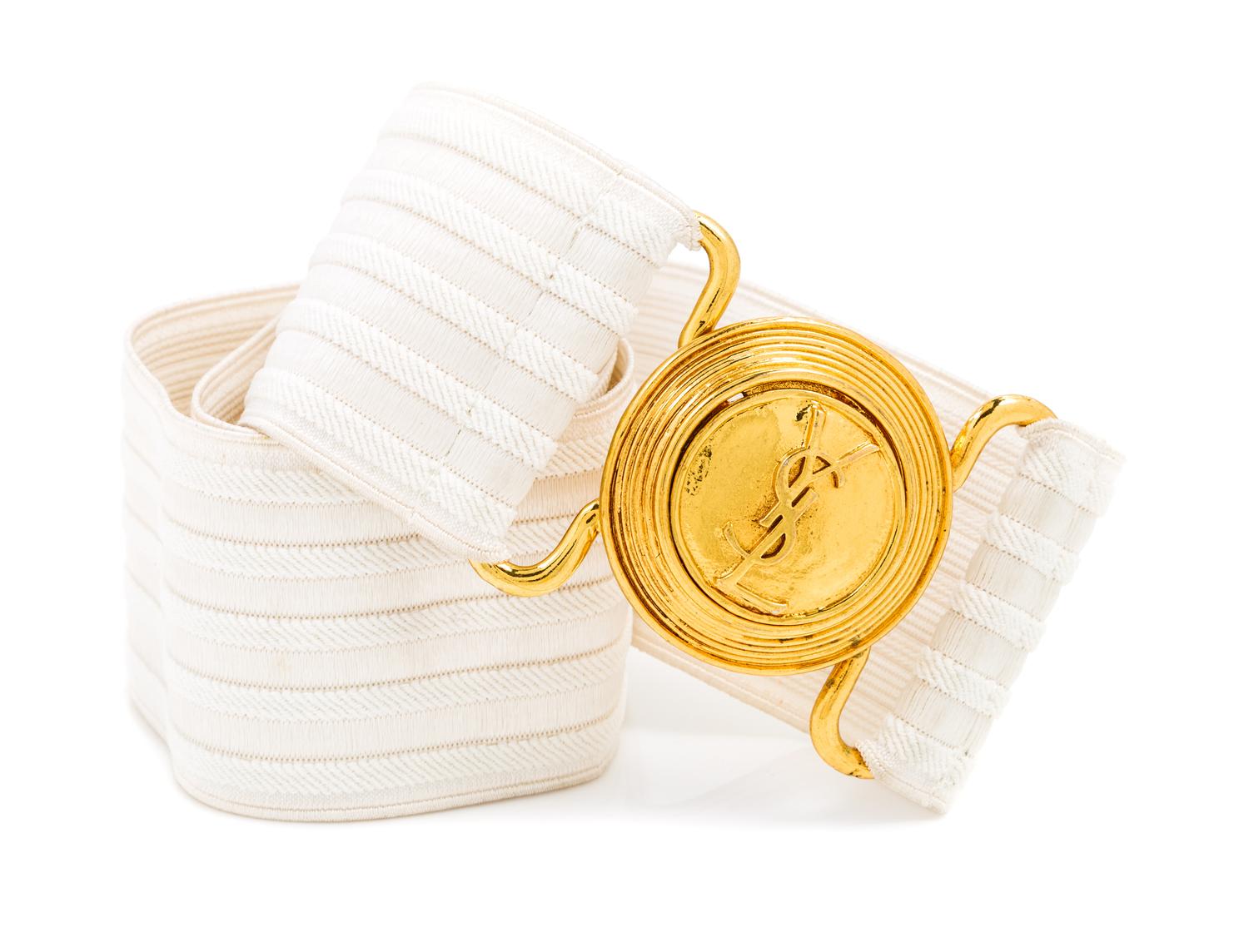 An Yves Saint Laurent White Stretch Belt, 34" x 2.25".