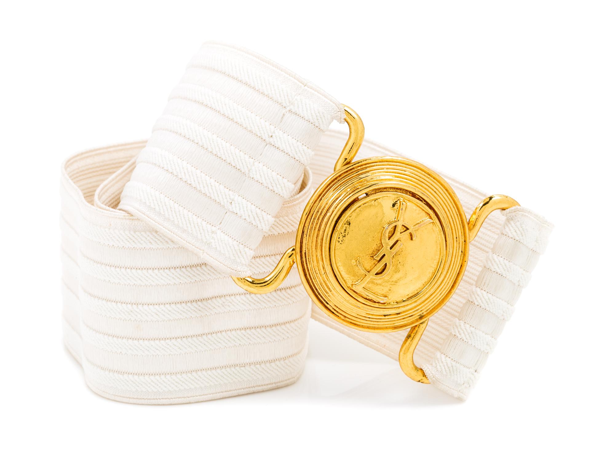 An Yves Saint Laurent White Stretch Belt, 34" x 2.25".