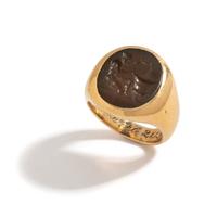 A Roman Carnelian Ring Stone with a Satyr Mixing Wine — Set in a gold ring