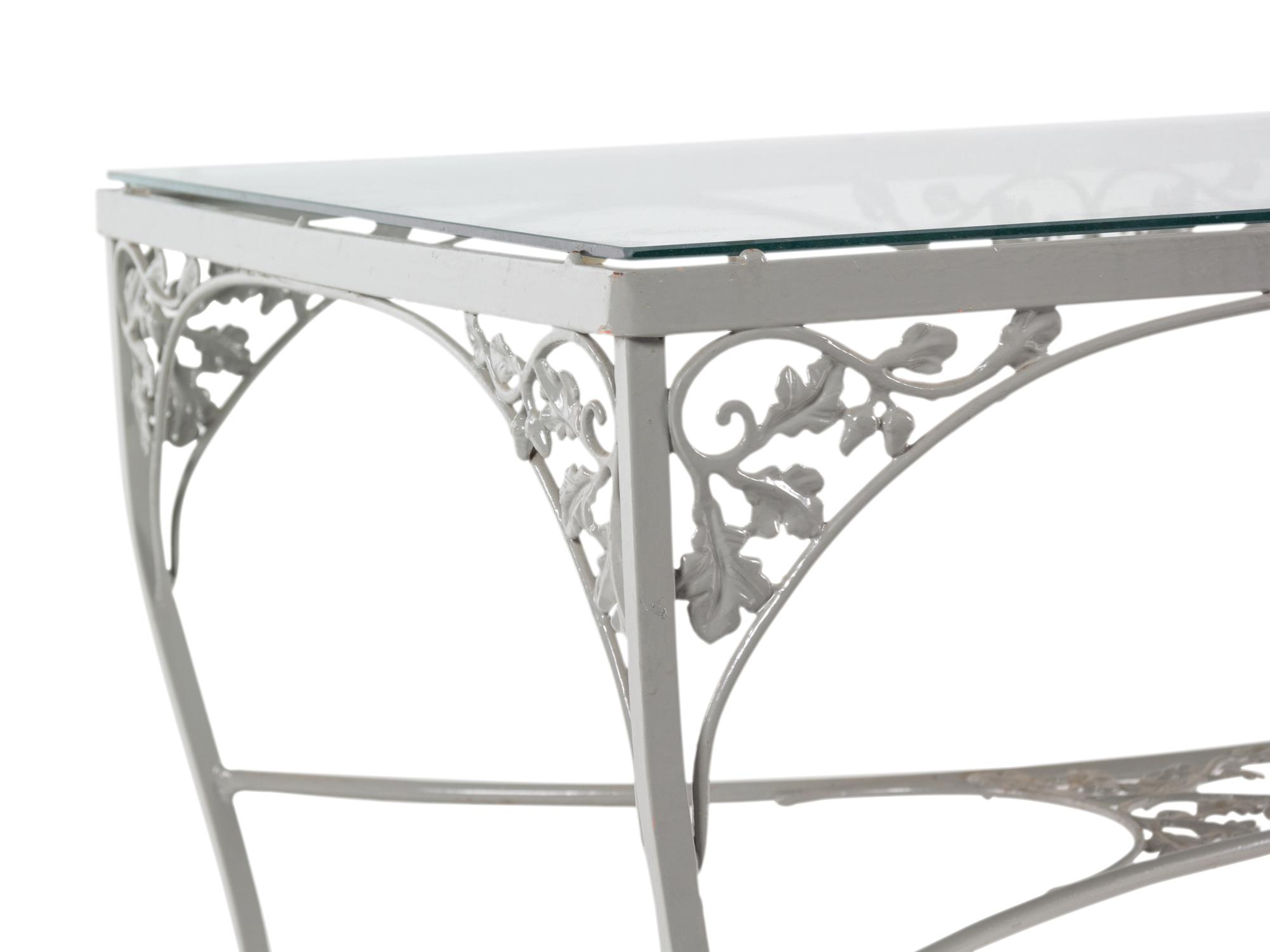 A Woodard "Orleans" Style Painted Iron Garden Table and Four Chairs