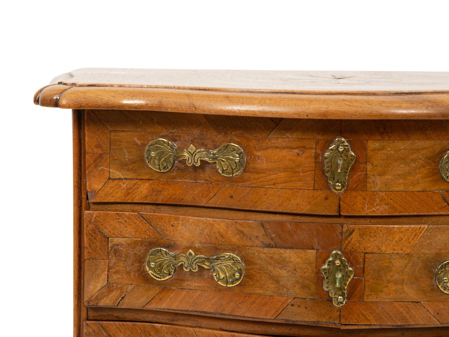 A French Walnut Marquetry Miniature Bow Front Commode