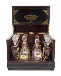 A Continental Ebonized and Brass Inlaid Cave a Liqueur, Height of case 10 3/8 x width 12 3/8 x depth 9 1/2 inches.