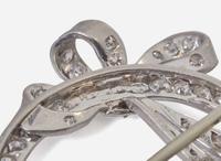A Platinum and Diamond Circle Pin