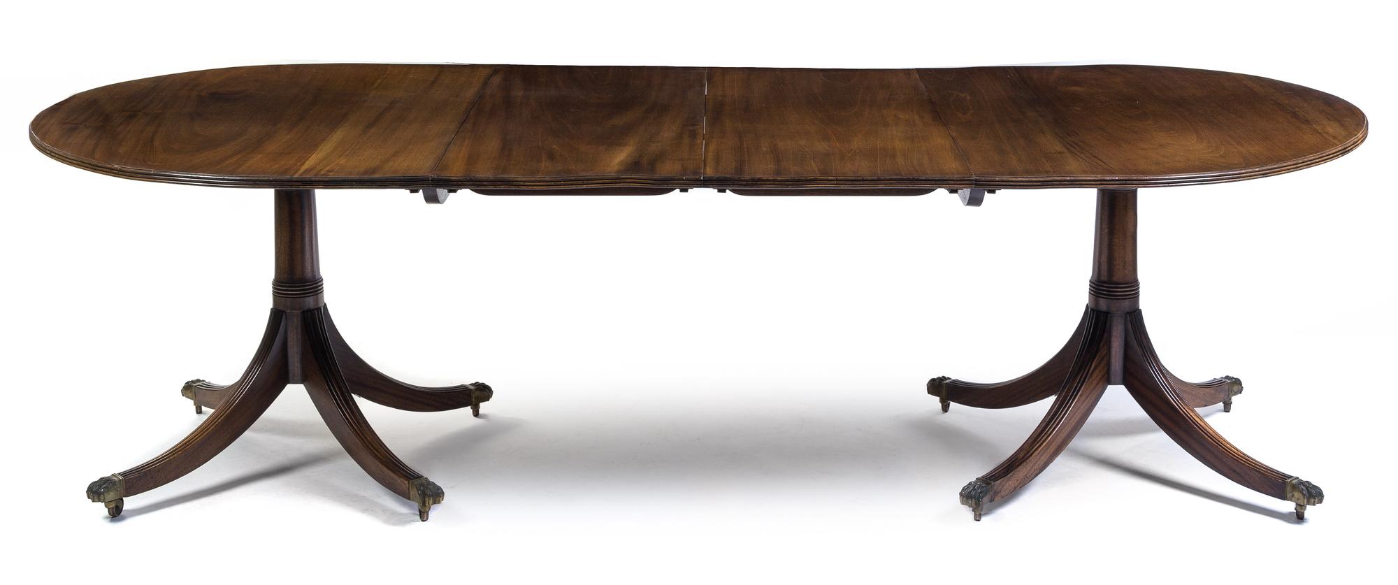 A George III Style Mahogany Double Pedestal Dining Table Height 27 3/4 x depth 44 x length 96 inches.