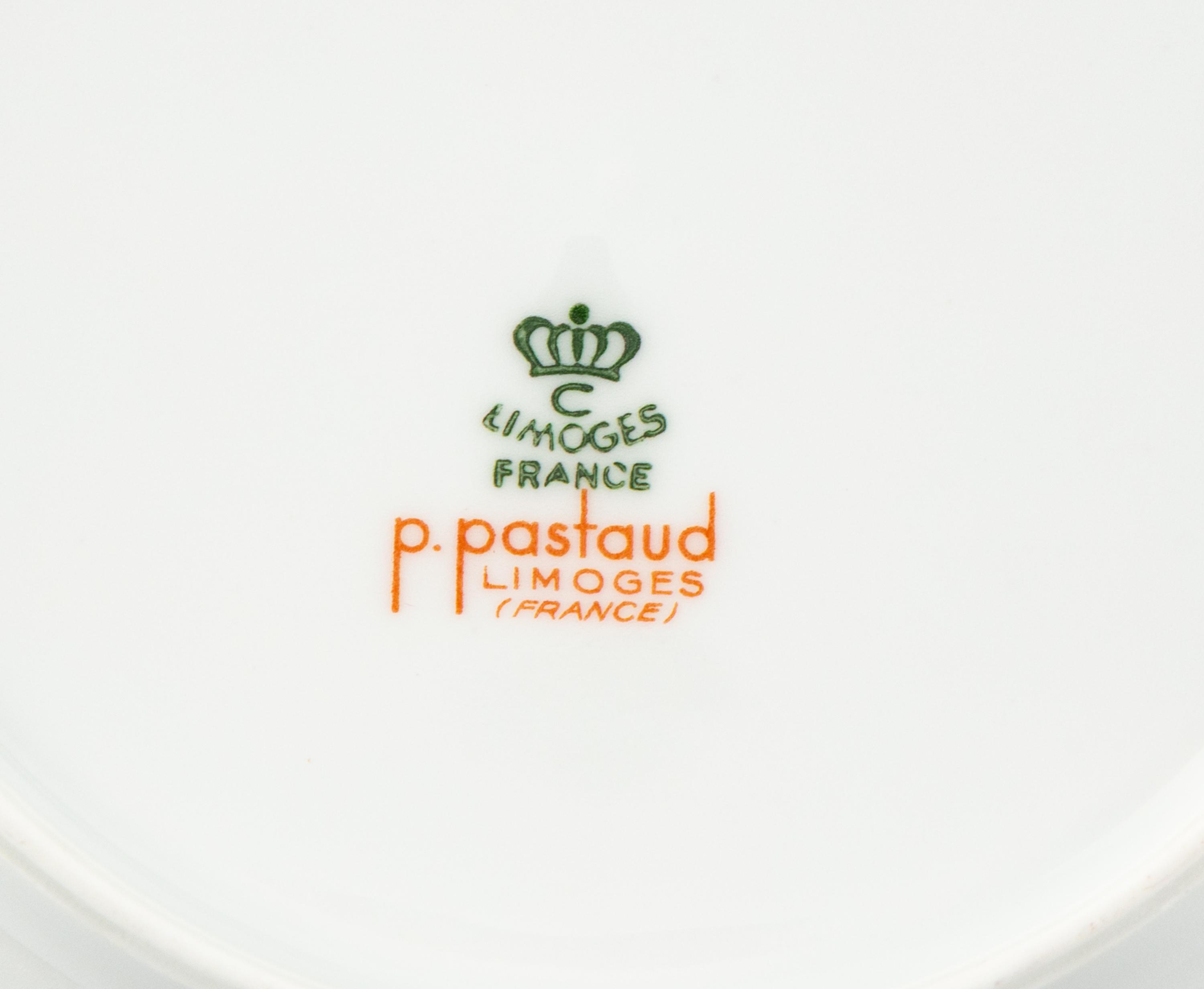 A Set of Eight Limoges Porcelain Soup Plates