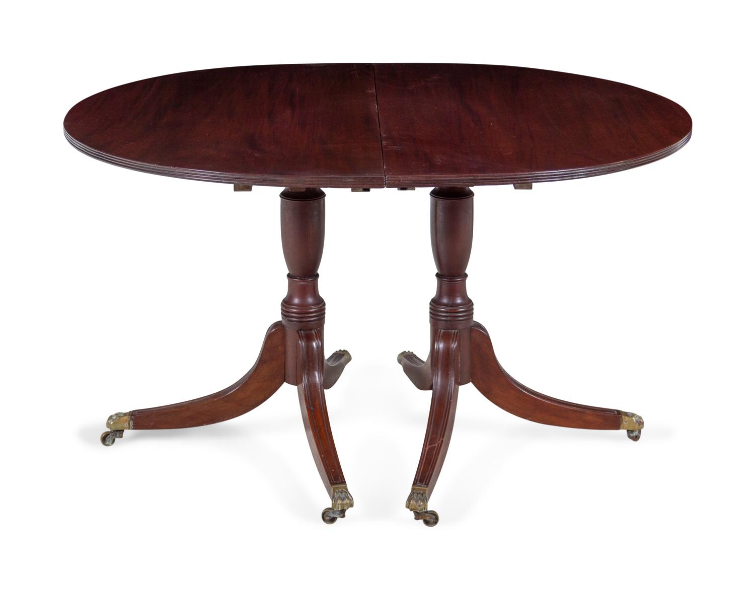 A Regency Style Mahogany Double Pedestal Extension Dining Table — 20TH CENTURY