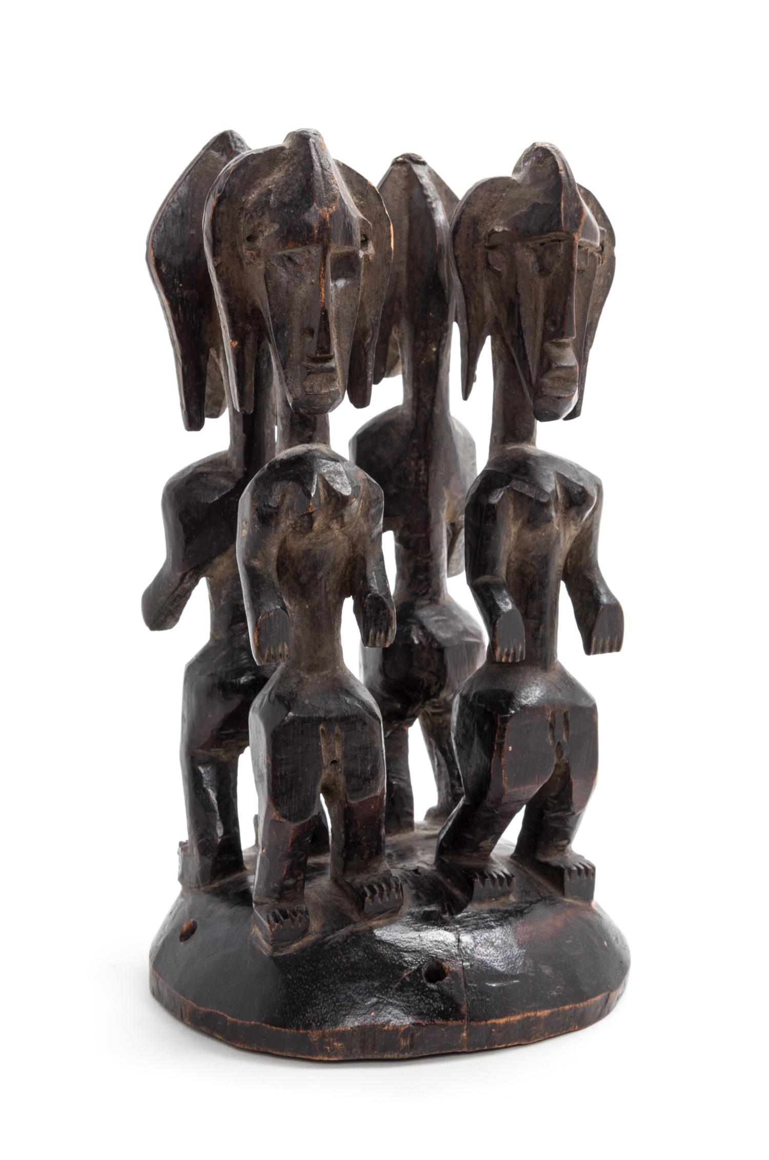 A Bamana Carved Wood Headdress Height 11 1/2 x diameter 6 inches.