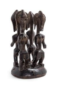 A Bamana Carved Wood Headdress Height 11 1/2 x diameter 6 inches.