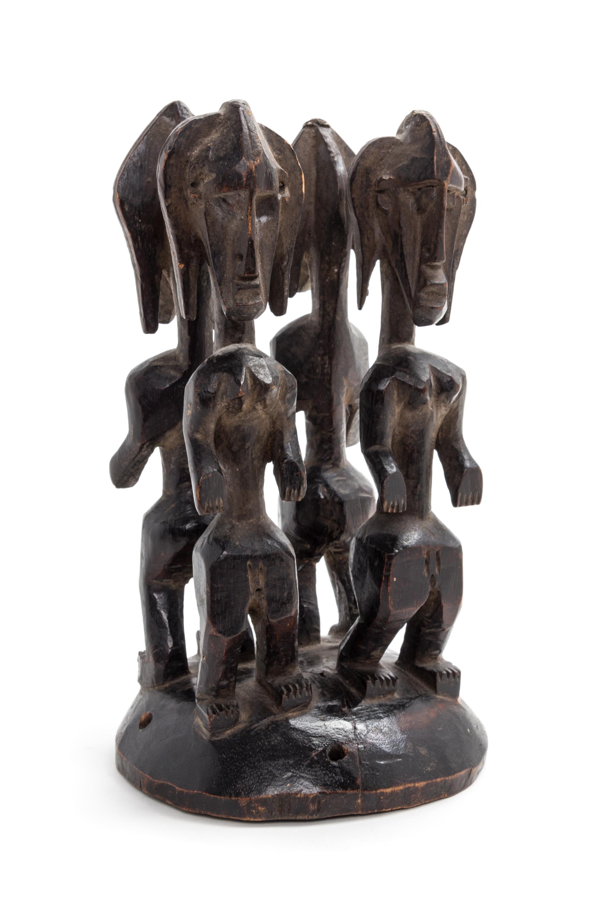 A Bamana Carved Wood Headdress Height 11 1/2 x diameter 6 inches.