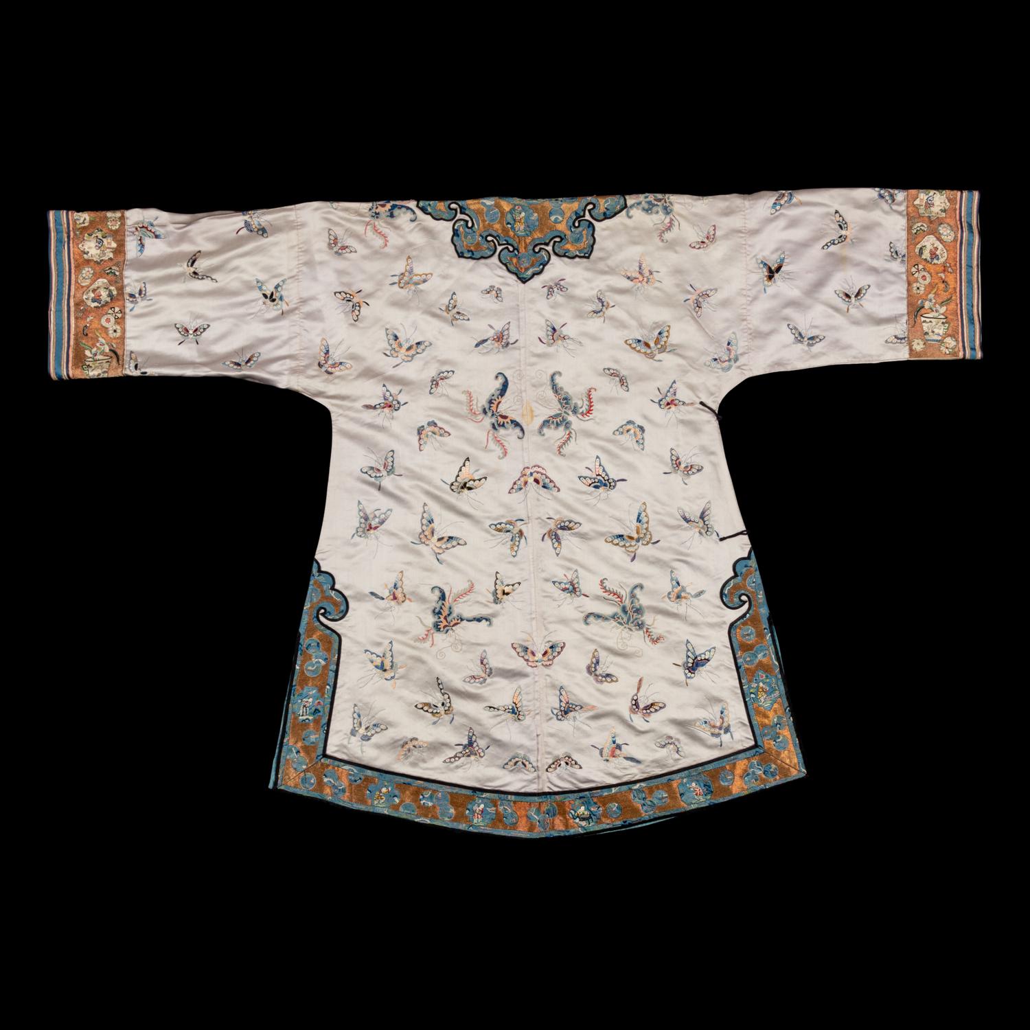 A Chinese Pale Blue Ground Embroidered Silk 'Butterfly' Lady's Informal Robe, Late Qing/Republic Period 晚清/民國 月白緞地百蝶紋女襖