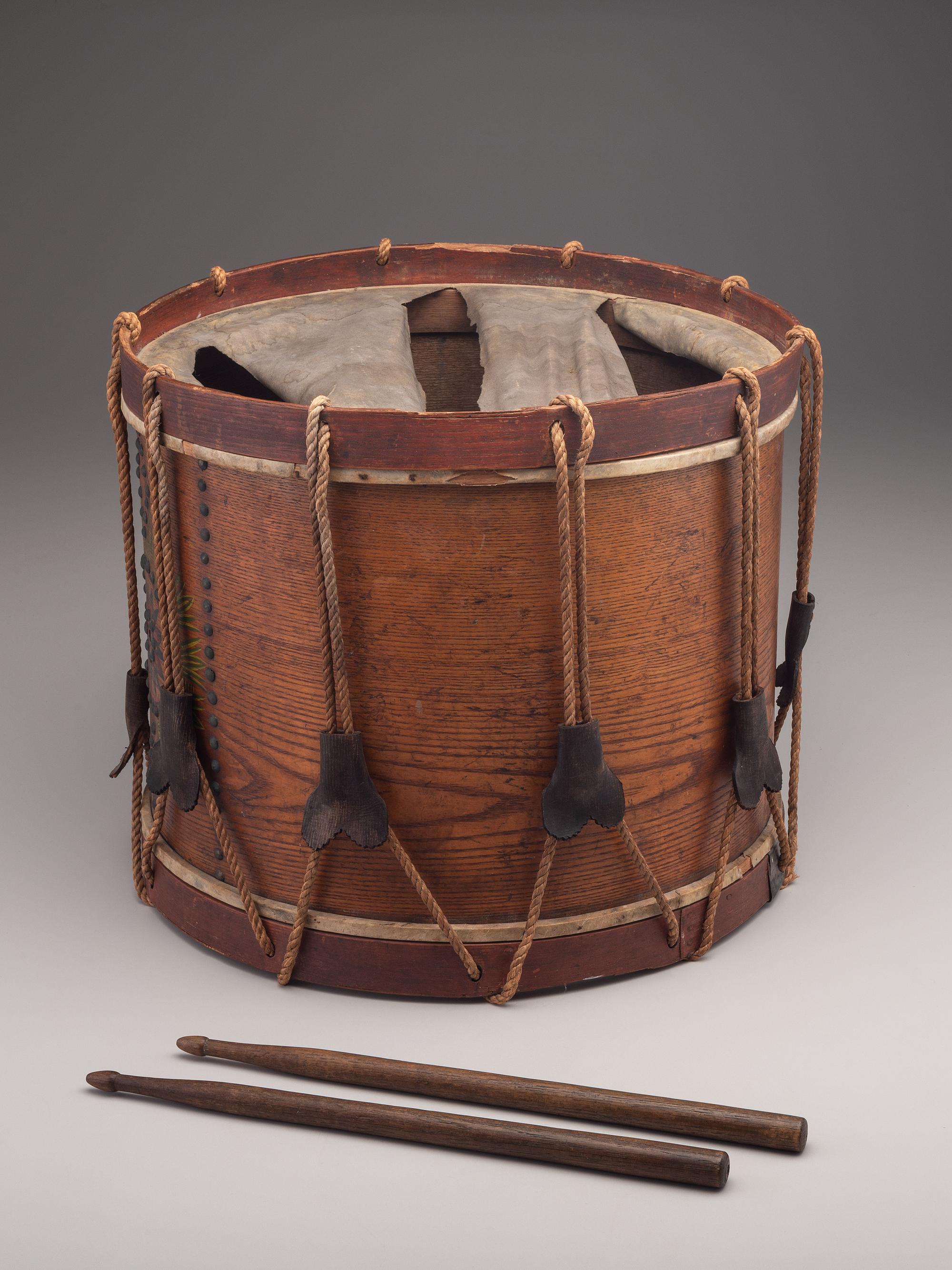[MILITARIA]. Possibly Mexican War painted drum featuring ornate tack design, with drumsticks.
