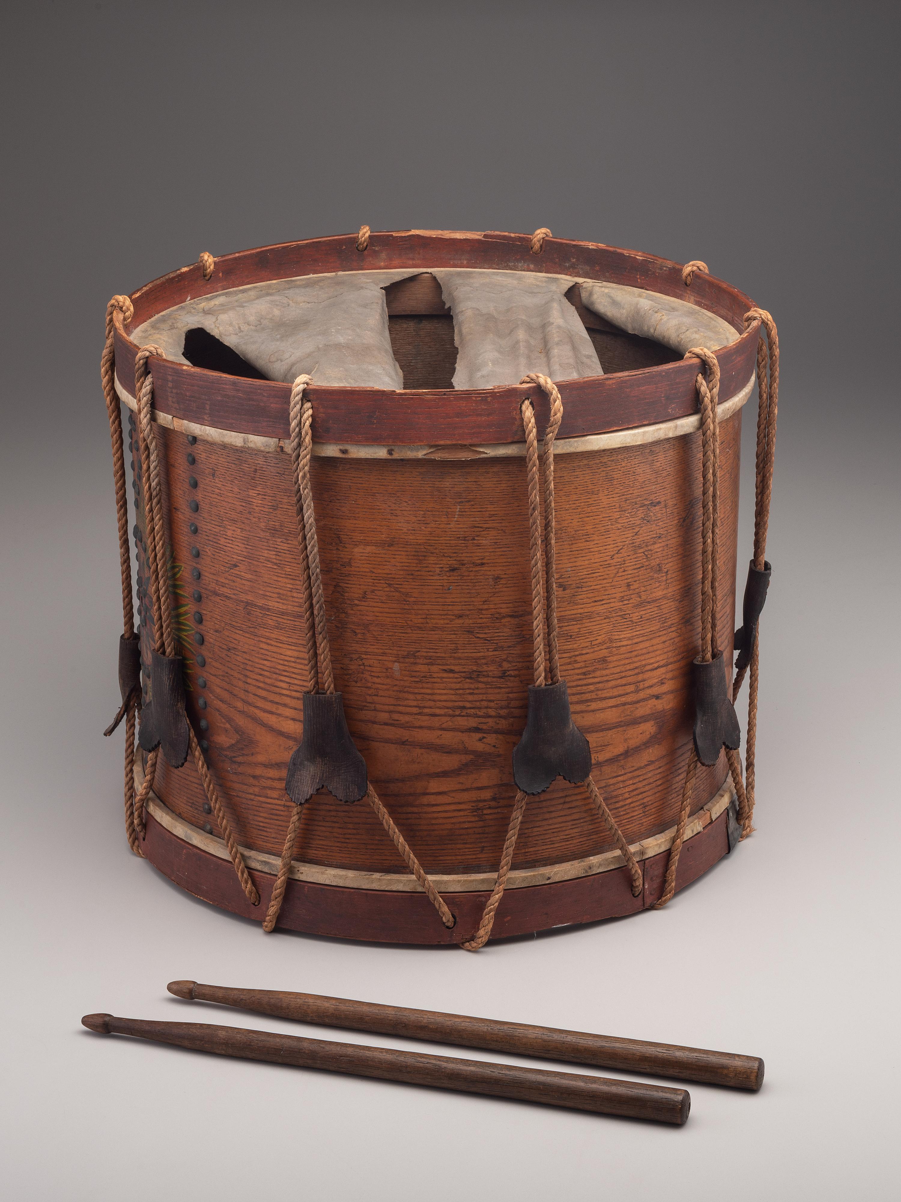 [MILITARIA]. Possibly Mexican War painted drum featuring ornate tack design, with drumsticks.