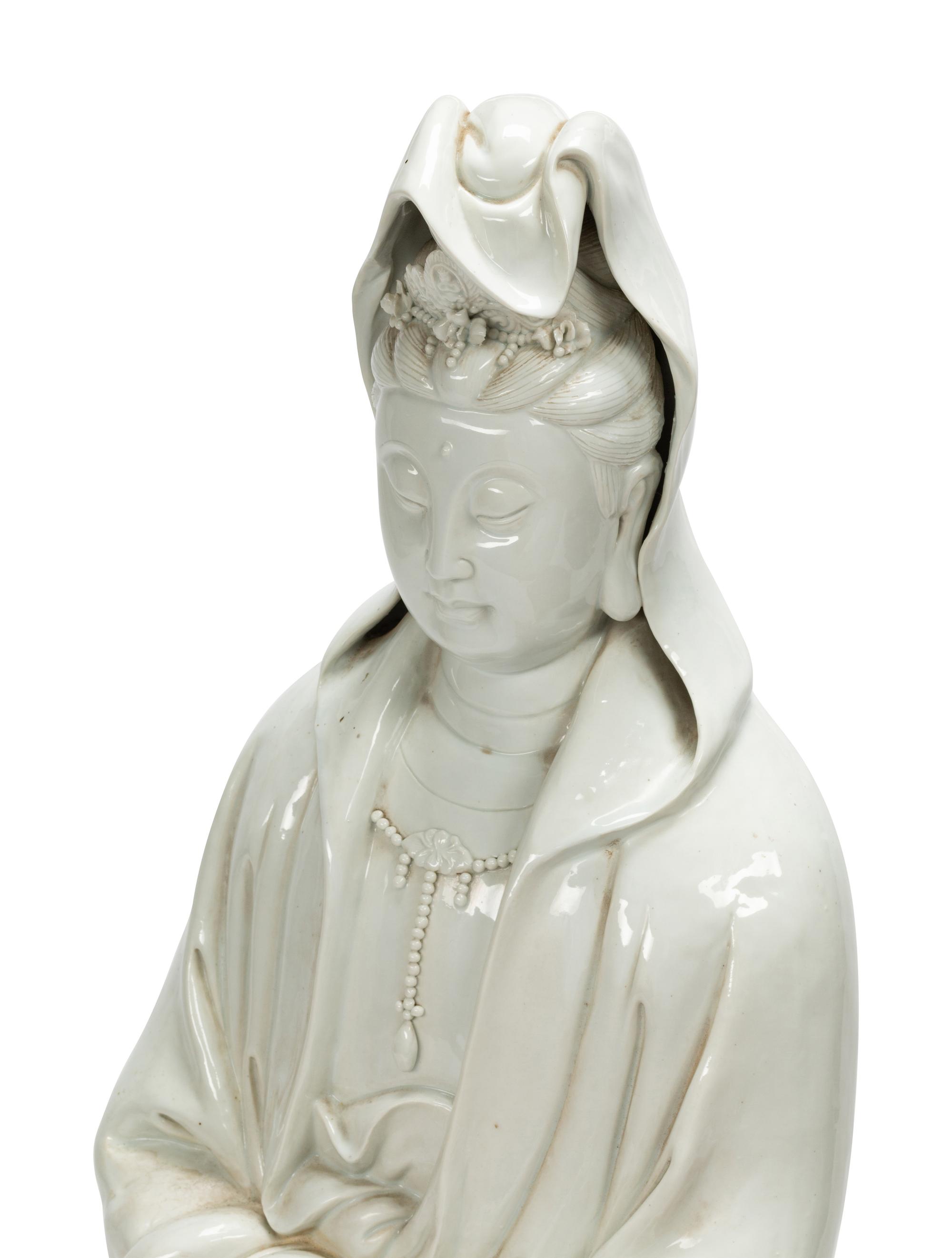 A Large Chinese Export White Glazed Porcelain Figure of Guanyin