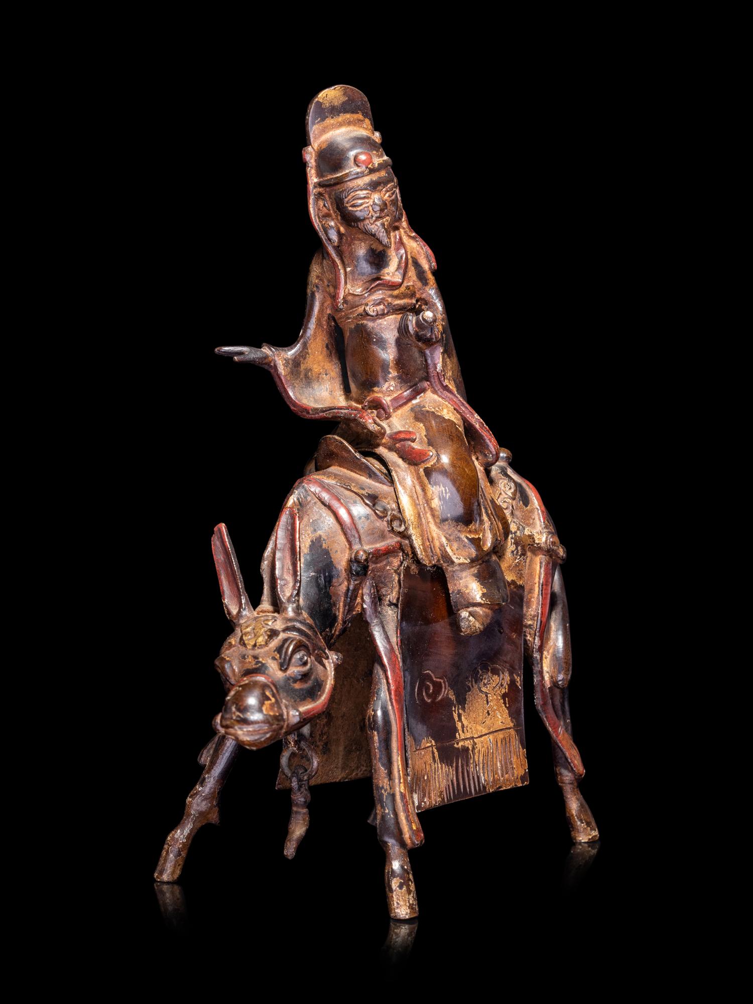 A Chinese Parcel-Gilt Bronze Figural-Form Incense Burner