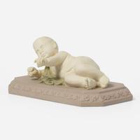 A Wedgwood Tricolor Jasperware Figure of a Reclining Infant UK, circa 1800