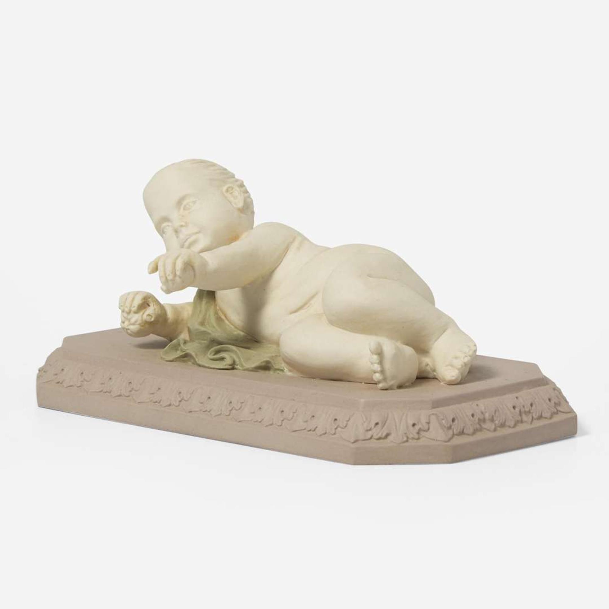 A Wedgwood Tricolor Jasperware Figure of a Reclining Infant UK, circa 1800