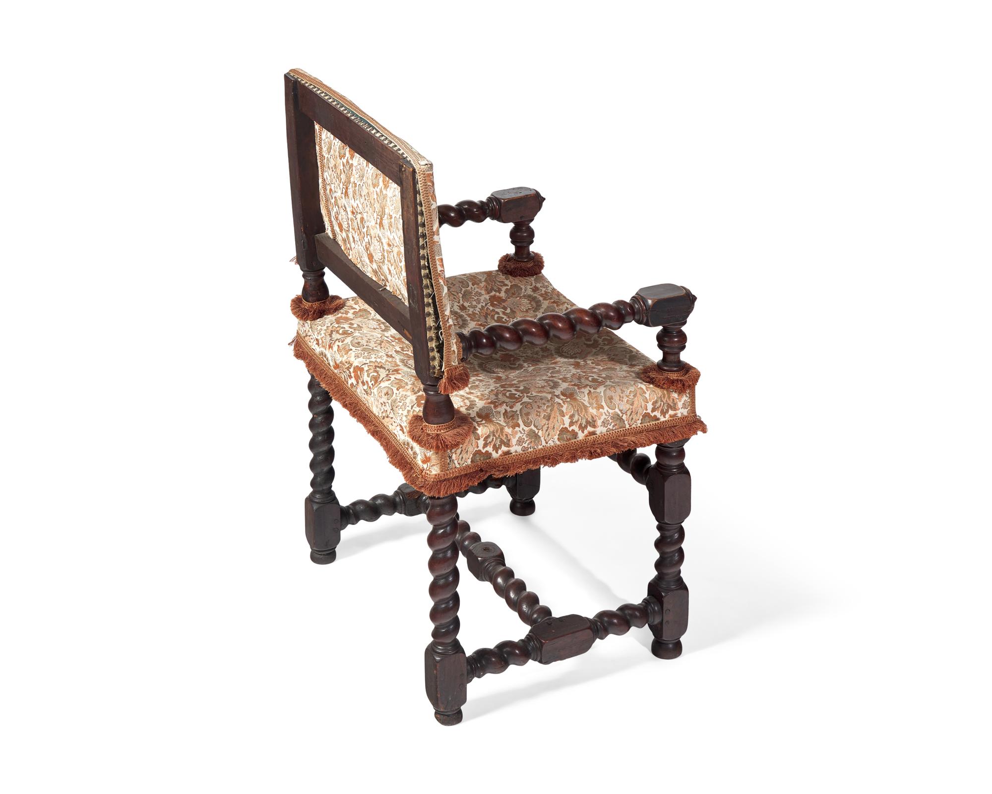 A Baroque Walnut Turned and Carved Barley Twist Armchair