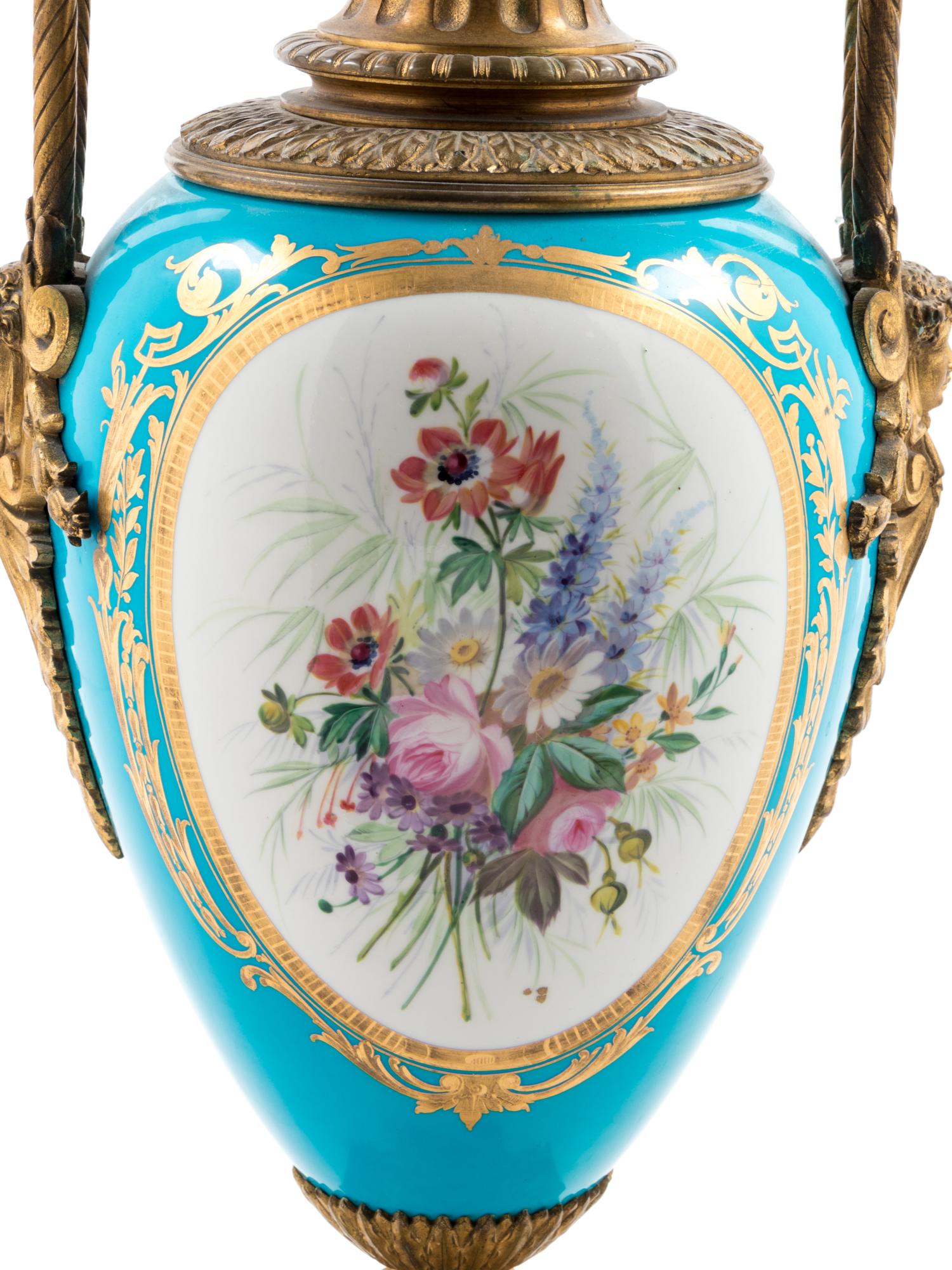 A Sèvres Style Gilt Bronze Mounted Painted and Parcel Gilt Celeste-Blue Ground Porcelain Seven-Light Candelabrum