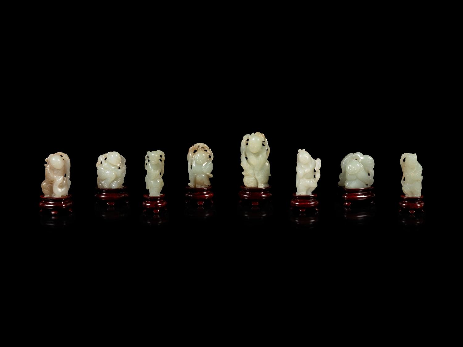 Eight Chinese Celadon Jade Figures of Boys