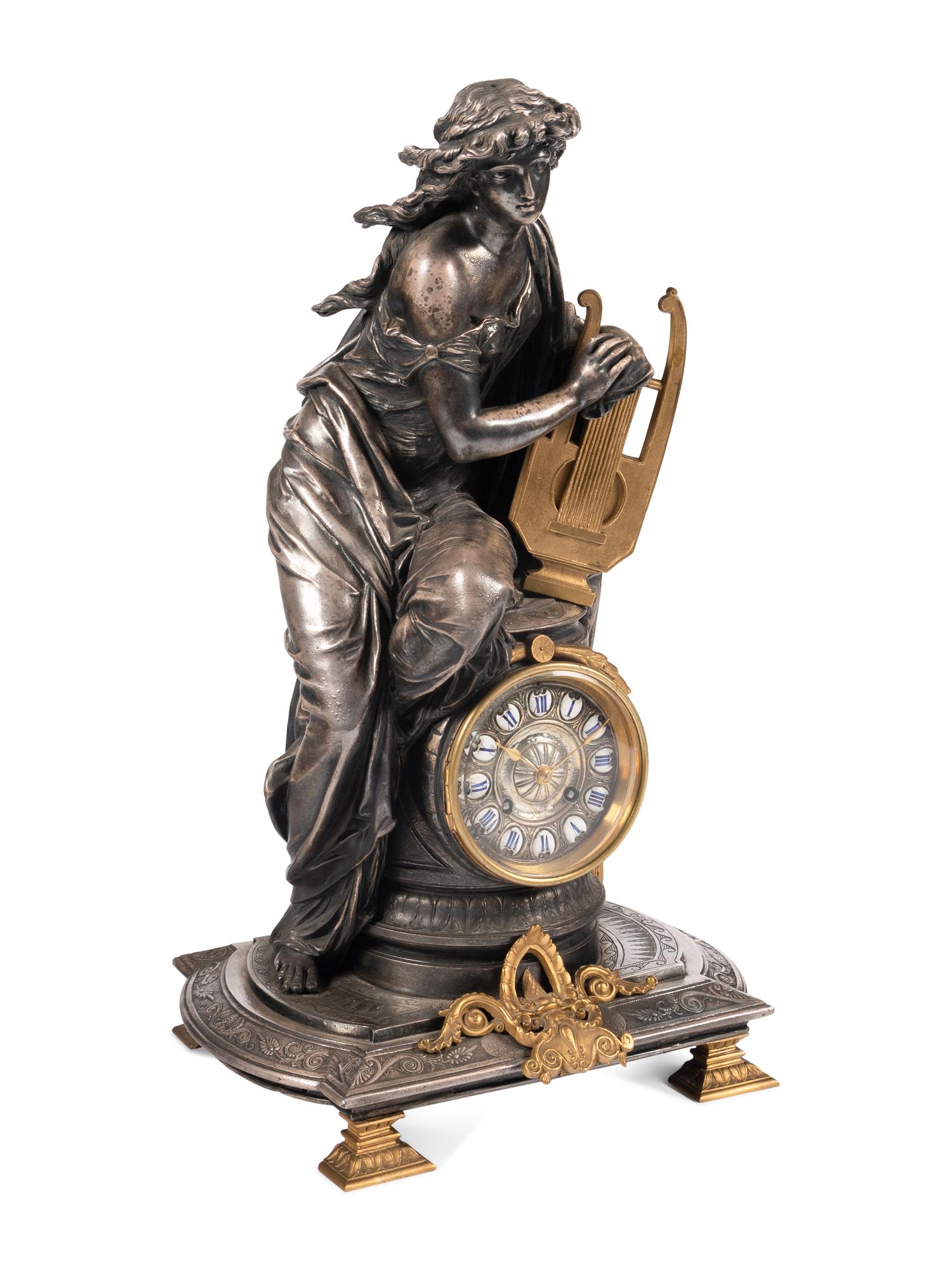 A French Gilt Bronze and Cast Metal Figural Clock