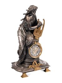 A French Gilt Bronze and Cast Metal Figural Clock